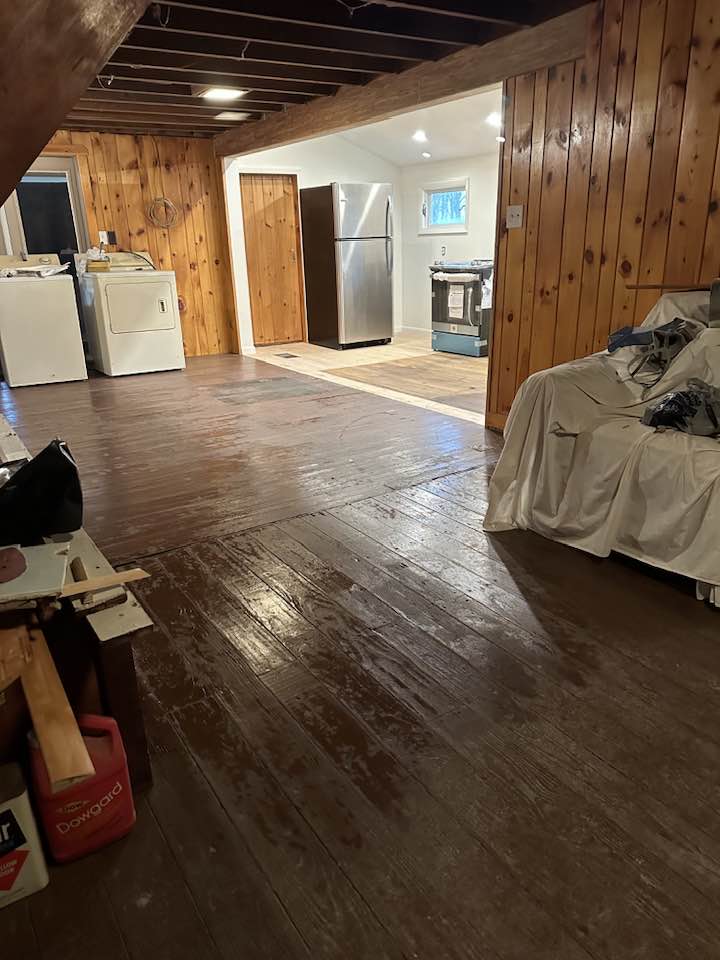 Basement renovation showing framing and electrical rough-in work.