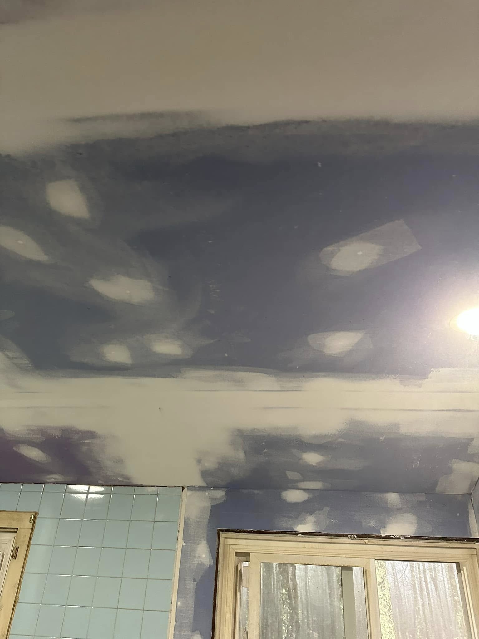 Completed drywall finishing with smooth sanded surface ready for paint.