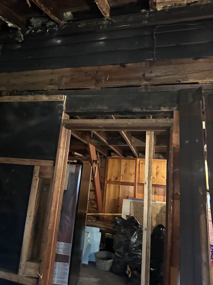 Finished basement living space with painted walls and ceiling.