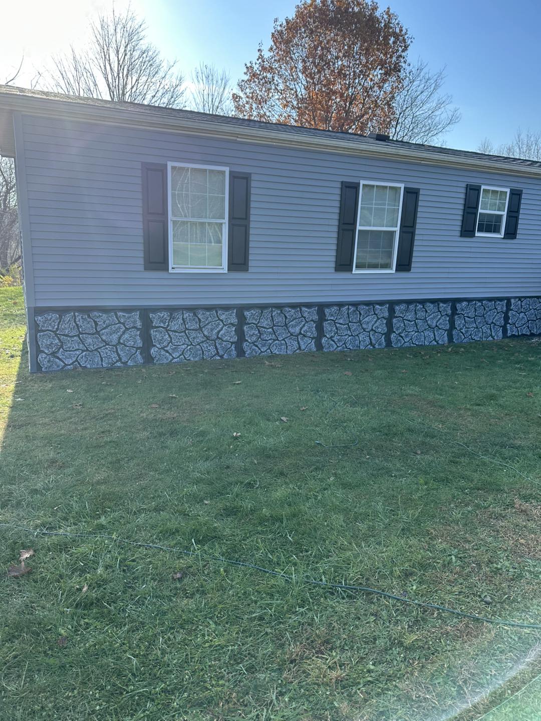 Professional vinyl siding installation on a residential home in Dallas PA by Jay and Sons Construction.